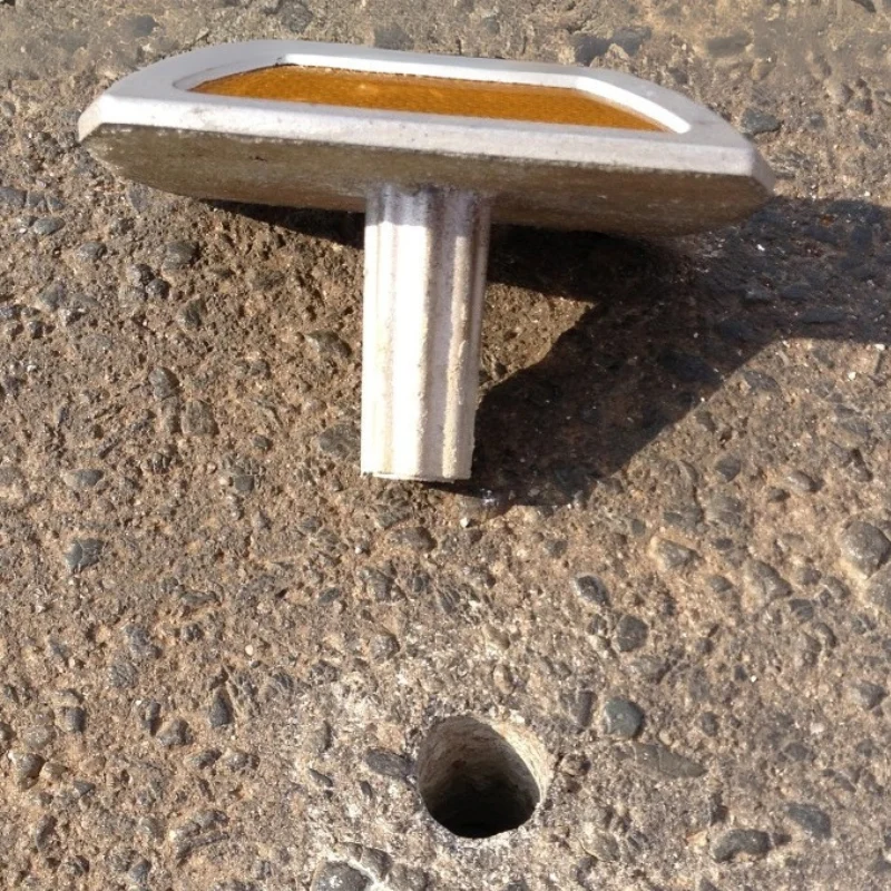 Metal-shank road stud installation